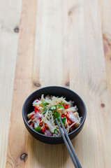 Jelly fish hot spicy and sour salad on wooden table, Thai food thai style.