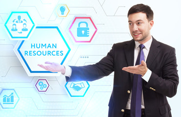Business, Technology, Internet and network concept. Young businessman working on a virtual screen of the future and sees the inscription: Human resources