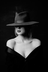 Fototapeta na wymiar Style woman in hat. Portrait of black and white color style