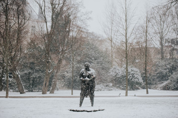 stature in the snow in Amsterdam