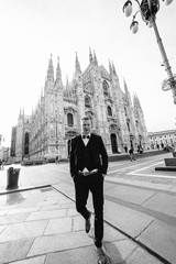 stylish groom posing in Italy