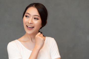 smart thoughtful asian woman thinking, planning; portrait of asian woman looking up, thinking,...