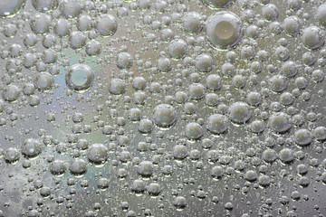 small bubbles and drops oil and water background texture gray abstraction