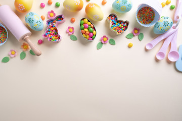 Baking and cooking concept. Cookie cutters, whisk, roller pin and kitchen bake tools for making sweets. Top view of a holiday baking still life. Sweet recipe cookbook.