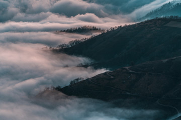 Obraz premium Detail of the beautiful fog between the mountains of the Basque country one winter morning