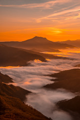 Fototapeta na wymiar Sea of clouds under Mount Larrun in a beautiful sunrise. Basque Country