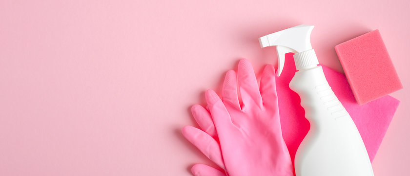 Cleaning supplies on pink background. Cleaning service banner design with spray bottle, pink gloves and sponge. Housecleaning services concept. - Powered by Adobe