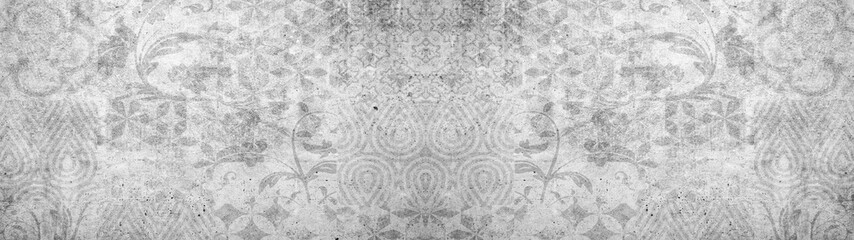 Old gray vintage shabby damask patchwork tiles stone concrete cement wall texture background banner