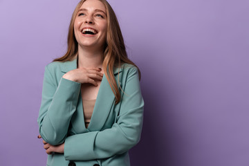 Woman laughing posing indoors isolated