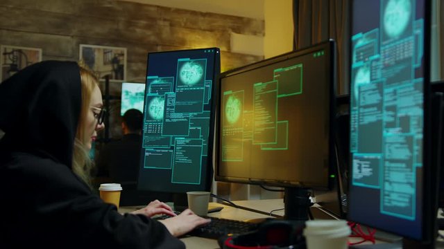 Hooded hacker girl gets access denied while trying to steal - Powered by Adobe