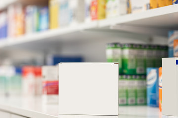 Decanter packs of pills on the background of a shelf with pills