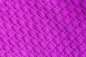 Abstract textured background of pink knitting