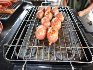 grilling  sausages on hot stoves