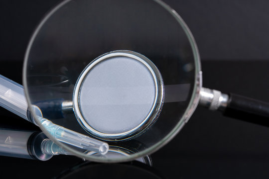 Magnifier and stethoscope with medical concept.