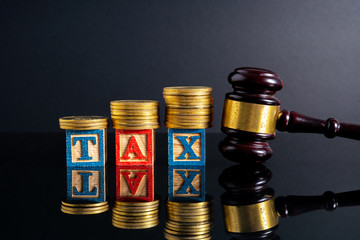 Gavel hammer and stacking coins with financial concept.