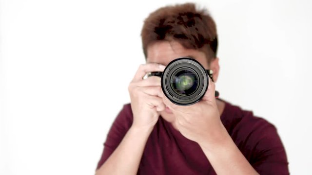 4k Asian man photographer using camera taking photo on isolate white background.