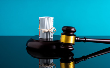 Banknotes with gavel hammer with law concept.