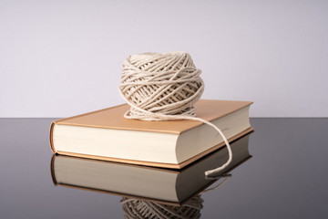 Rope and book with white background.