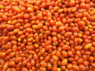 Full frame shot of fresh tomatos for sale in local market. tomatos background, farmer fruit market.