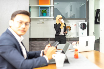 Business couple with workplace enviroment