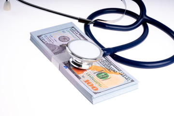 Stethoscope and banknote with white background