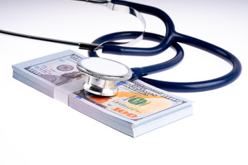 Stethoscope and banknote with white background