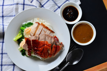Rice roasted duck and crispy skin pork belly with gravy sauce