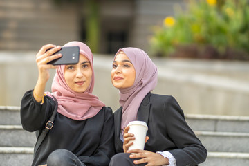 Group of businesswoman discuss each other with natural lighting.