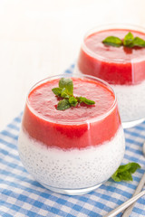 Chia pudding with mashed berry and fresh mint.