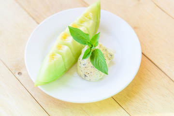 ice cream melon on wood table