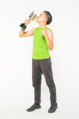 Young teenager holding trophy with successful lifestyle concept