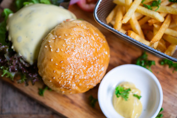 Hamburger with French fries Lettuce and Cheese