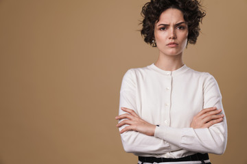 Image of displeased caucasian woman posing and looking at camera