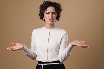 Image of annoyed caucasian woman posing and holding copyspace
