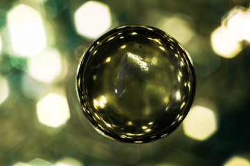 Macrophotography of a glass ball with lights inside and bokeh outside