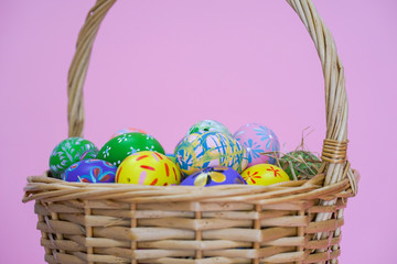 the painted colorful Easter egg on isolated pink background copyspace celebrating the festival christian 
