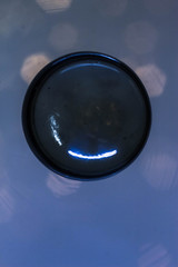 Macrophotography of a glass ball with lights inside and bokeh outside
