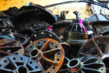 A pile of rusty old car parts at the old car spare parts market