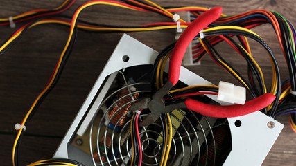 Red pliers and colored wires, top view