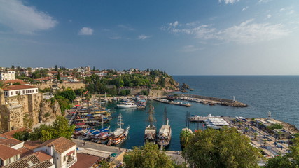 Fototapeta premium Aerial view of yacht harbor and red house roofs in 