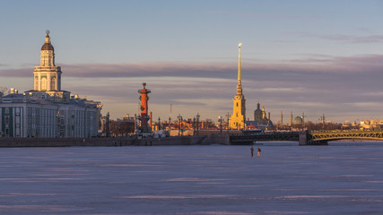 Winter in St. Petersburg. View of the city and the frozen river on a sunny day.