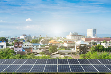 Solar panel with modern Country town city construction and skyscrapers background,clean Alternative power energy concept.