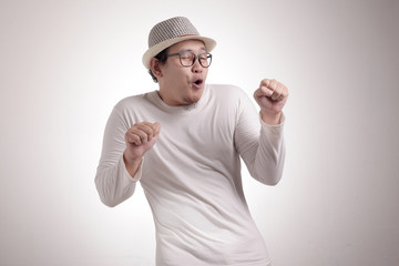 Fototapeta premium Happy Funny Asian Man Dancing Full of Joy, Winning