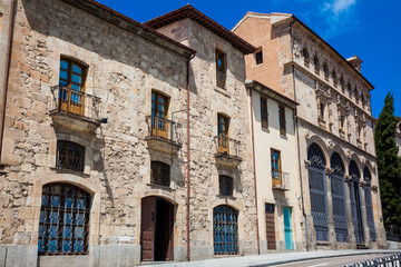 Fototapeta na wymiar Facade of the beautiful historical buildings located on the San Pablo street in Salamanca city center