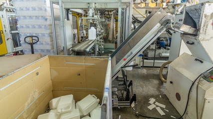 A factory for plastic canister production timelapse . The conveyor in the factory.