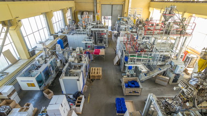 A factory for plastic canister production timelapse . The conveyor in the factory.