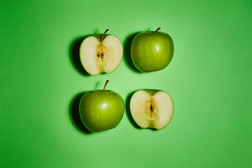 Apple on green background. Flat lay, top view, copy space . Food dietary concept.