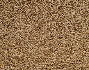 Chaotic surface of an insulanting panel made of wood fibers. Texture close  up.
