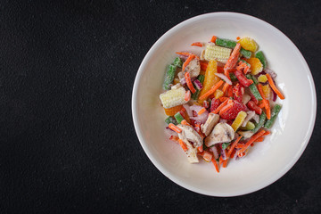 frozen vegetables mix salad onion, corn, pepper, paprika, mushrooms, asparagus beans, carrot and others, ketogenic diet menu concept. food background. top view. copy space