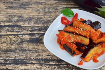 Terong Balado, Indonesian food. Fried eggplant with chili sauce garnish with sesame seeds